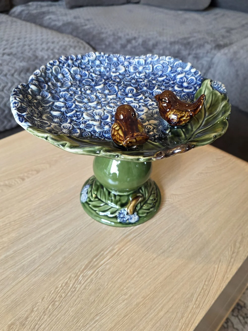 Ceramic Blue Floral Pedestal Bowl with Green Base and Brown Bird Accents